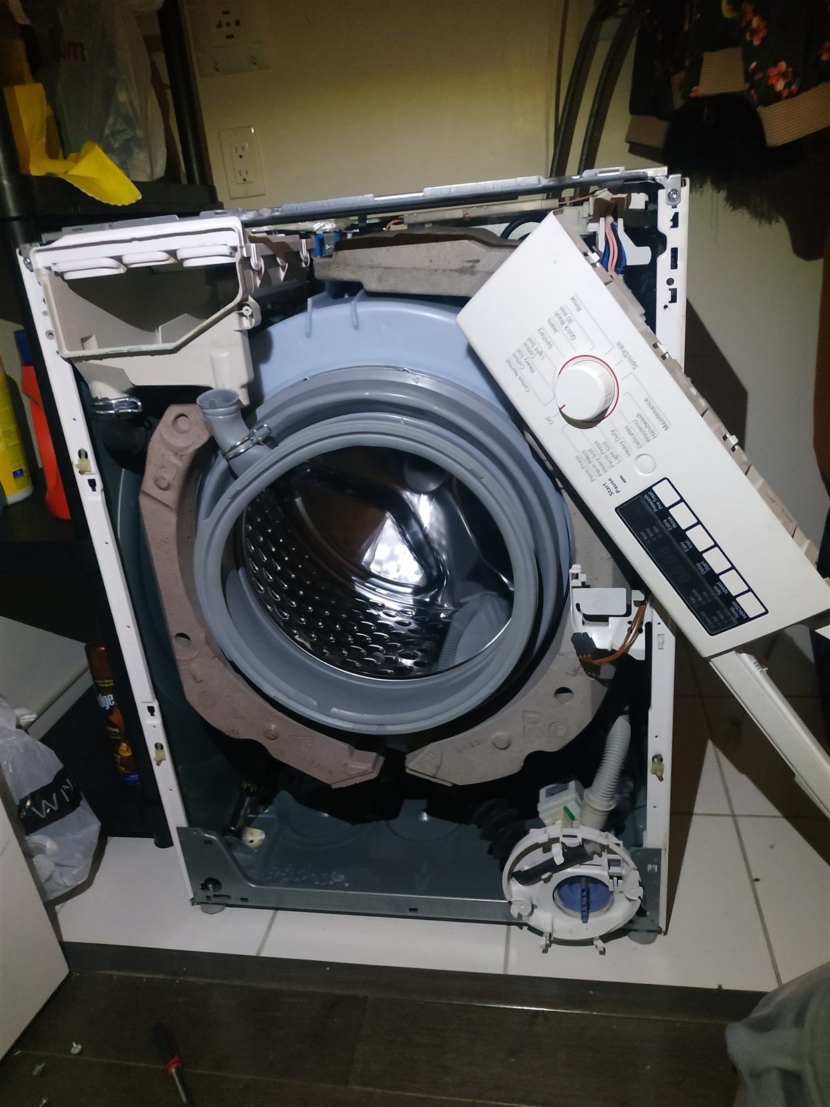 Front-load washer opened for diagnosis and repair