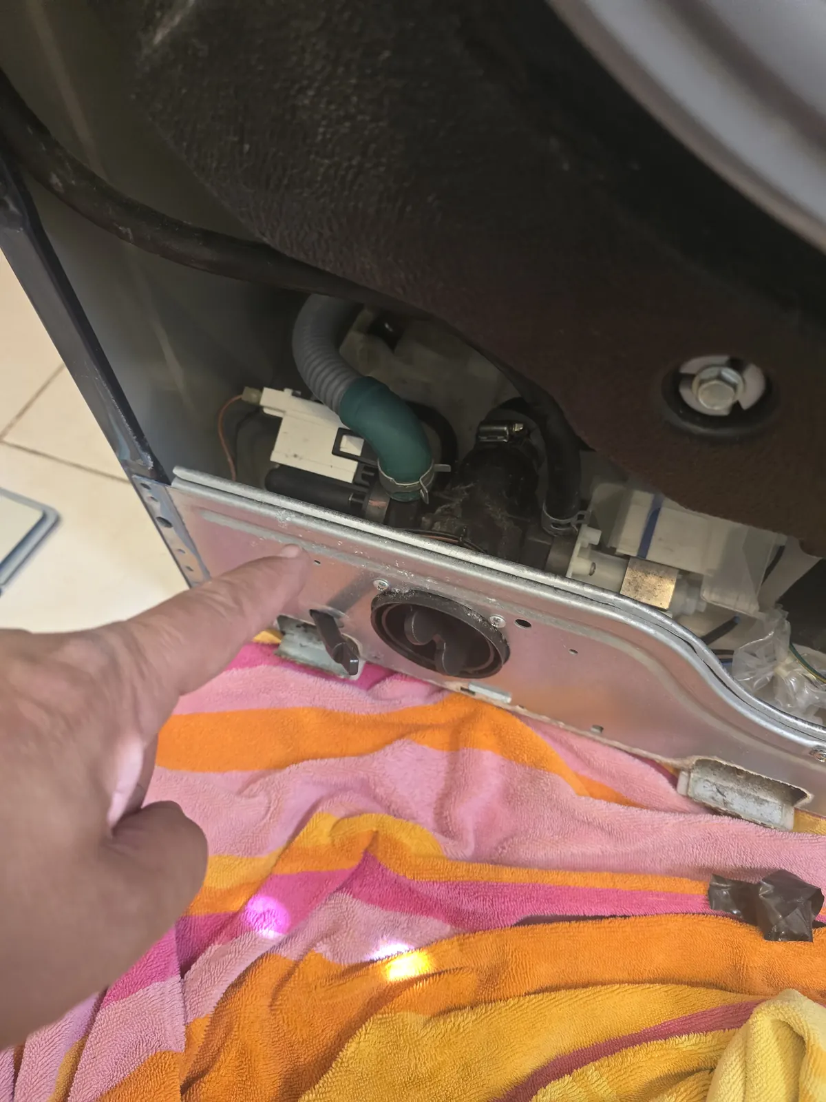 LG washer drain pump being replaced by an Appliance Trust technician in Maple Ontario